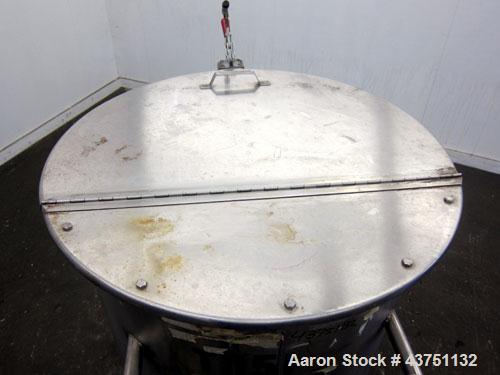 Used Water Cooling Corporation Tank, 100 Gallons, 304 Stainless Steel, Vertical. Approximately 31" diameter x 34" straight side.  Flat top with a bolt-on hinged cover, 6" sloped bottom.  2" Tri-clamp...
