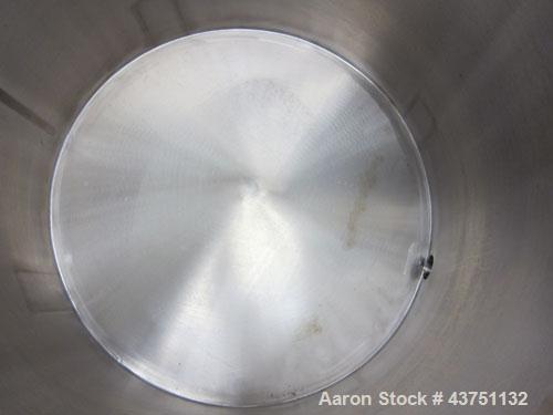 Used Water Cooling Corporation Tank, 100 Gallons, 304 Stainless Steel, Vertical. Approximately 31" diameter x 34" straight side.  Flat top with a bolt-on hinged cover, 6" sloped bottom.  2" Tri-clamp...