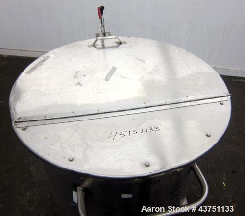 Used Water Cooling Corporation Tank, 100 Gallons, 304 Stainless Steel, Vertical. Approximately 31" diameter x 34" straight side.  Flat top with a bolt-on hinged cover, 6" sloped bottom.  2" Tri-clamp...