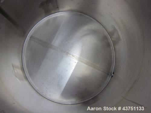 Used Water Cooling Corporation Tank, 100 Gallons, 304 Stainless Steel, Vertical. Approximately 31" diameter x 34" straight side.  Flat top with a bolt-on hinged cover, 6" sloped bottom.  2" Tri-clamp...
