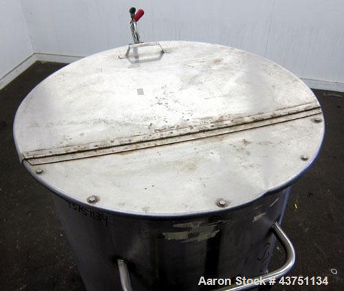 Used Water Cooling Corporation Tank, 100 Gallons, 304 Stainless Steel, Vertical. Approximately 31" diameter x 34" straight side.  Flat top with a bolt-on hinged cover, 6" sloped bottom.  2" Tri-clamp...