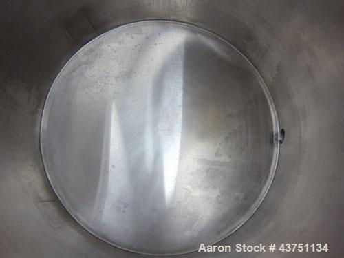 Used Water Cooling Corporation Tank, 100 Gallons, 304 Stainless Steel, Vertical. Approximately 31" diameter x 34" straight side.  Flat top with a bolt-on hinged cover, 6" sloped bottom.  2" Tri-clamp...