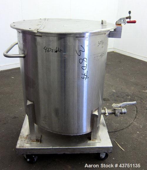Used Water Cooling Corporation Tank, 100 Gallons, 304 Stainless Steel, Vertical. Approximately 31" diameter x 34" straight side.  Flat top with a bolt-on hinged cover, 6" sloped bottom.  2" Tri-clamp...