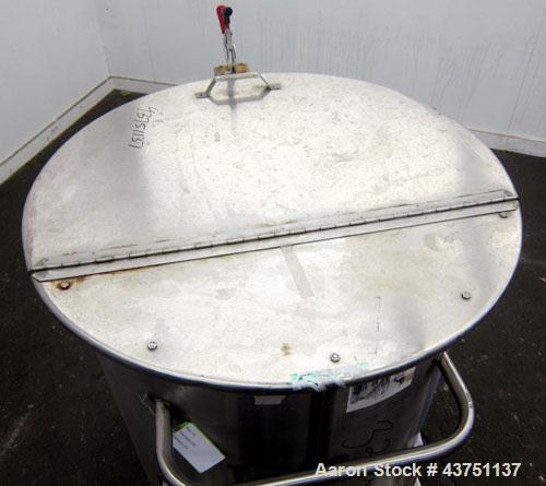 Used Water Cooling Corporation Tank, 100 Gallons, 304 Stainless Steel, Vertical. Approximately 31" diameter x 34" straight side.  Flat top with a bolt-on hinged cover, 6" sloped bottom.  2" Tri-clamp...
