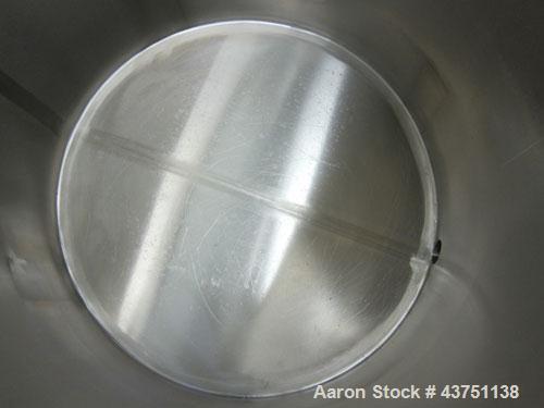 Used Water Cooling Corporation Tank, 100 Gallons, 304 Stainless Steel, Vertical. Approximately 31" diameter x 34" straight side.  Flat top with a bolt-on hinged cover, 6" sloped bottom.  2" Tri-clamp...