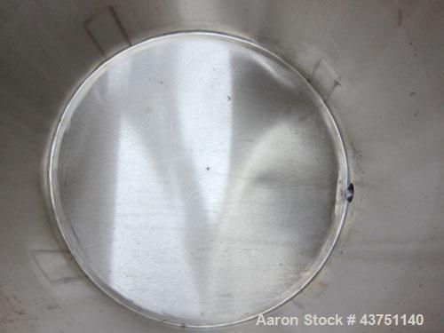Used Water Cooling Corporation Tank, 100 Gallons, 304 Stainless Steel, Vertical. Approximately 31" diameter x 34" straight side.  Flat top with a bolt-on hinged cover, 6" sloped bottom.  2" Tri-clamp...