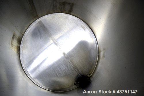 Used Water Cooling Corporation Tank, 100 Gallon, 304 Stainless Steel, Vertical. Approximately 31" diameter x 34" straight side.  Flat top with a bolt-on hinged cover, 6" sloped bottom.  2" Tri-clamp ...