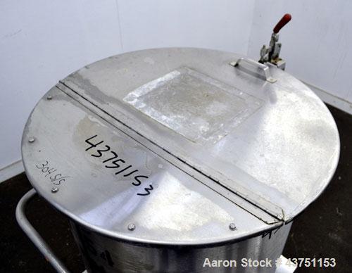 Used Water Cooling Corporation Tank, 100 Gallon, 304 Stainless Steel, Vertical. Approximately 31" diameter x 34" straight side.  Flat top with a bolt-on hinged cover, 6" sloped bottom.  2" Tri-clamp ...