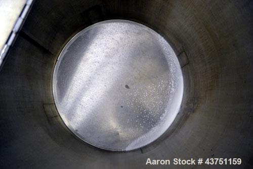 Used Water Cooling Corporation Tank, 100 Gallon, 304 Stainless Steel, Vertical. Approximately 31" diameter x 34" straight side.  Flat top with a bolt-on hinged cover, 6" sloped bottom.  2" Tri-clamp ...