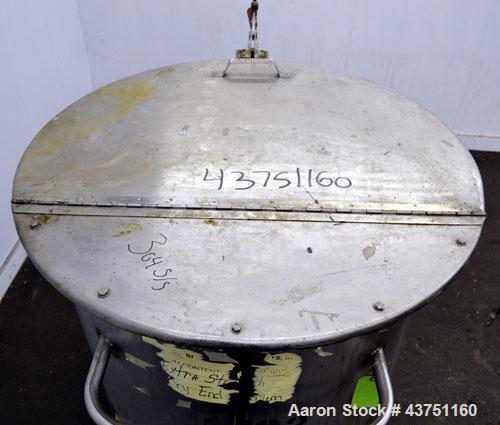 Used Water Cooling Corporation Tank, 100 Gallon, 304 Stainless Steel, Vertical. Approximately 31" diameter x 34" straight side.  Flat top with a bolt-on hinged cover, 6" sloped bottom.  2" Tri-clamp ...