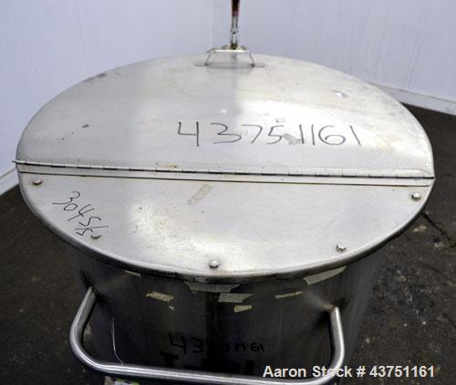 Used Water Cooling Corporation Tank, 100 Gallon, 304 Stainless Steel, Vertical. Approximately 31" diameter x 34" straight side.  Flat top with a bolt-on hinged cover, 6" sloped bottom.  2" Tri-clamp ...