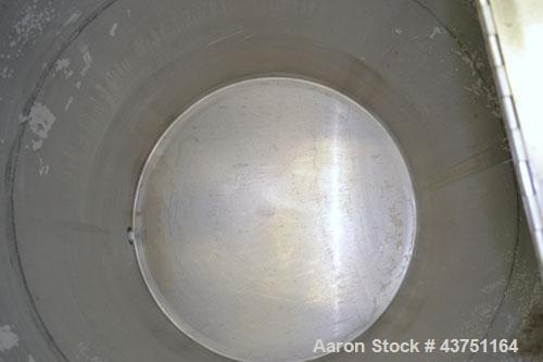 Used Water Cooling Corporation Tank, 100 Gallon, 304 Stainless Steel, Vertical. Approximately 31" diameter x 34" straight side.  Flat top with a bolt-on hinged cover, 6" sloped bottom.  2" Tri-clamp ...
