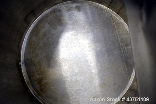 Used Water Cooling Corporation Tank, 60 Gallon, 304 Stainless Steel, Vertical. Approximately 30-1/2" diameter x 21" straight side. Flat top with a bolt-on hinged cover, 6" sloped bottom.  2" Tri-clam...
