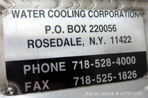 Used Water Cooling Corporation Tank, 60 Gallon, 304 Stainless Steel, Vertical. Approximately 30-1/2" diameter x 21" straight side.  Flat top with a bolt-on hinged cover, 6" sloped bottom.  2" Tri-cla...