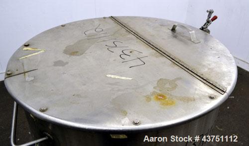 Used Water Cooling Corporation Tank, 60 Gallons, 304 Stainless Steel, Vertical. Approximately 30-1/2" diameter x 21" straight side.  Flat top with a bolt-on hinged cover, 1" sloped bottom.  2" Tri-cl...