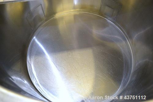 Used Water Cooling Corporation Tank, 60 Gallons, 304 Stainless Steel, Vertical. Approximately 30-1/2" diameter x 21" straight side.  Flat top with a bolt-on hinged cover, 1" sloped bottom.  2" Tri-cl...