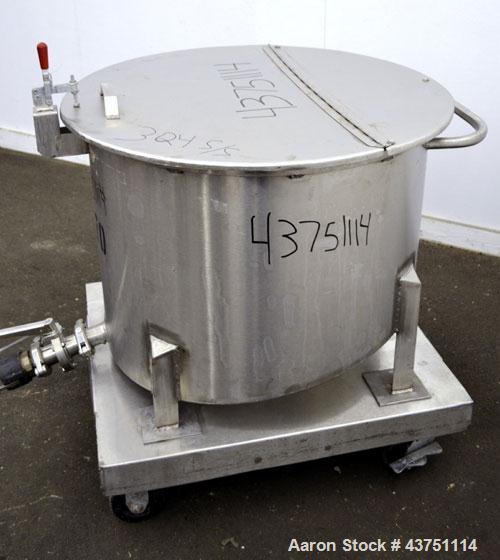 Used Water Cooling Corporation Tank, 60 Gallons, 304 Stainless Steel, Vertical. Approximately 30-1/2" diameter x 21" straight side.  Flat top with a bolt-on hinged cover, 6" sloped bottom.  2" Tri-cl...