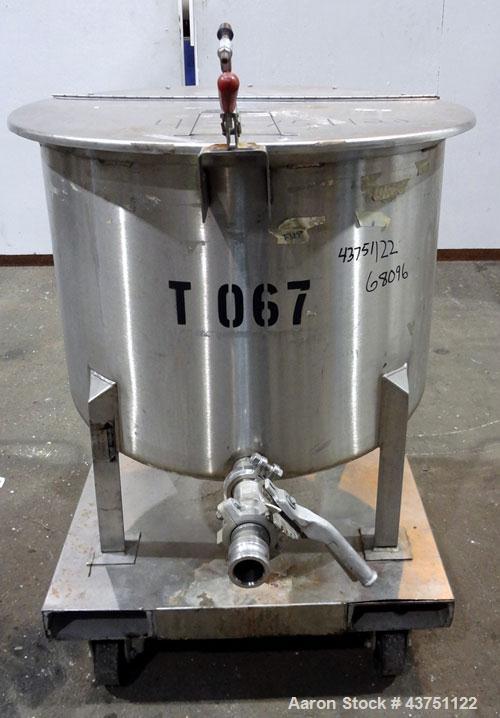 Used Water Cooling Corporation Tank, 60 Gallons, 304 Stainless Steel, Vertical. Approximately 30-1/2" diameter x 21" straight side.  Flat top with a bolt-on hinged cover, 6" sloped bottom.  2" Tri-cl...