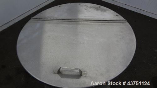 Used Water Cooling Corporation Tank, 60 Gallons, 304 Stainless Steel, Vertical. Approximately 30-1/2" diameter x 21" straight side.  Flat top with a bolt-on hinged cover, 6" sloped bottom.  2" Tri-cl...
