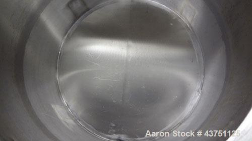 Used Water Cooling Corporation Tank, 60 Gallons, 304 Stainless Steel, Vertical. Approximately 30-1/2" diameter x 21" straight side.  Flat top with a bolt-on hinged cover, 6" sloped bottom.  2" Tri-cl...