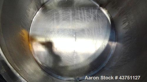 Used Water Cooling Corporation Tank, 60 Gallons, 304 Stainless Steel, Vertical. Approximately 30-1/2" diameter x 21" straight side.  Flat top with a bolt-on hinged cover, 6" sloped bottom.  2" Tri-cl...
