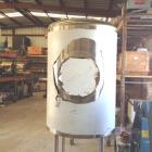 Unused- Sanitary Construction Tank, Approximately 200 Gallon, Vertical. Dish top and bottom. Mounted on 3' legs. Approximate...