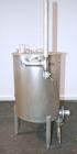 Used Tank, 110 Gallon, 304 Stainless Steel, Vertical. 30 Diameter x 36 straight side. Flat open top with a 1 piece cover, sloped bottom. Openings side 2 tri-clamp, 3 tri-clamp, 4 tri-clamp, 4 side bo...