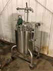 Used Permasan 44 Gallon SIngle Wall Stainless Steel Tank with Lightnin Mixer Modes XDA33. Mounted on casters with bottom valve.