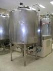 Used Stainless Steel Tank, 1500 liter capacity, 1200 mm diameter x 1350 mm high, jacketed, conical top with center bolted manway, conical bottom with 2' center discharge, fully welded insulation.  Ve...