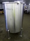 Used Tank, Approximately 250 Gallon, 316 Stainless Steel, Vertical. Flat top with a 1/3 hinged top cover, slight coned bottom. Provision for clamp on agitator (no agitator). Openings top (2) 1-1/2