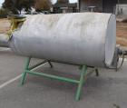 Used Tank, Approximate 300 Gallon, Stainless Steel, Horizontal. Approximate 36” diameter x 60” straight side, dished heads. Mounted on a carbon steel legs.