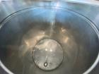 Used- Stainless Steel Tank, Approximate 100 Gallon, Stainless Steel, Vertical. Flat top, pitched bottom. Bottom outlet. Moun...