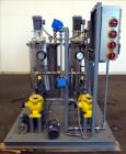 Used EnviroSep Packaged Mixing & Pumping System, Model 2S-MW-CF1. Consists of: (2) Tanks, each approximate 70 gallon, 304 stainless steel, vertical. 24