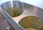 Used Dual Holding Tank, Approximately 200 Total Gallon, 304 Stainless Steel, Vertical. Consisting of (2) 30’’ diameter x 24’’ deep tanks, sloped bottoms. (1) 11’’ deep oval top common section with (2...