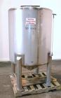 Used Sanitary Stainless Welding Tank, 325 Gallon, 304 Stainless Steel, Vertical. Approximate 44’’ diameter x 48’’ straight side. Flat top, coned bottom. Openings top (2) 1-1/2’’ tri-clamp, 15’’ man w...