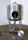 Used Tank, 450 Gallon, 304 Stainless Steel, Vertical. Approximate 60” diameter x 36” straight side, dished top and bottom. Top tangential inlet, top entering spray ball. Side 19” dameter man way with...