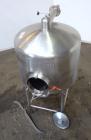 Used Tank, 450 Gallon, 304 Stainless Steel, Vertical. Approximate 60” diameter x 36” straight side, dished top and bottom. Top tangential inlet, top entering spray ball. Side 19” dameter man way with...