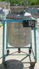 Used O.G. Kelley Co. Pressure Tank, 55 gallon, 304 stainless steel, vertical. 24'' diameter x 27'' straight side, dished top and bottom. Internal rated 50 psi at 300 deg F. Openings: top 10'' with co...
