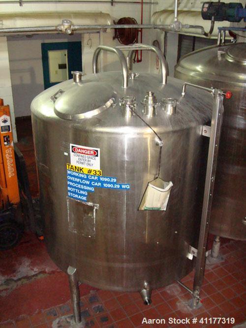 Used DCI 1000 gallon single wall vertical mixing tank (missing agitator motor and gearbox). 6' diameter x 5' straightwall x 9' overall height (would be 10' high with agitator). (4) stainless steel le...