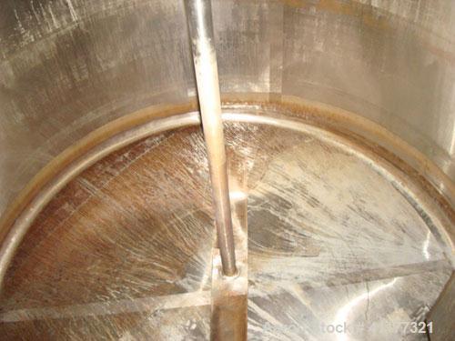 Used DCI 1000 gallon single wall vertical mixing tank. 6' diameter x 5' straightwall x 10' overall height. (4) stainless steel legs, sight glass, (3) 4" inlets, 2" and 3" front bottom front outlets. ...