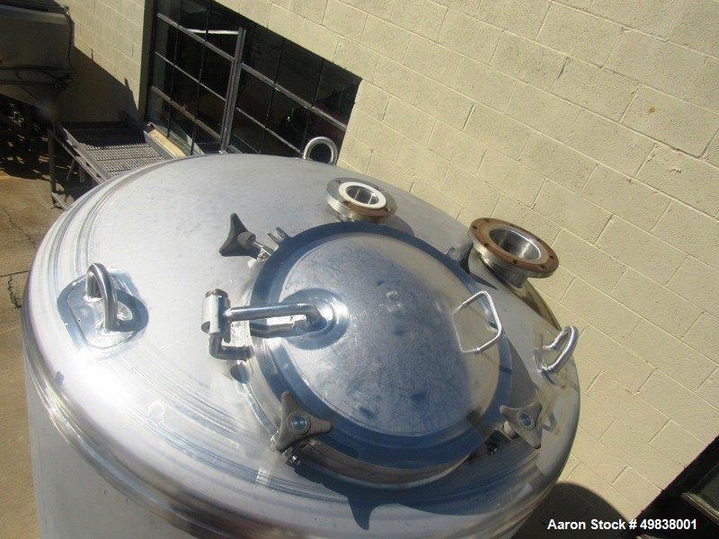 Used Lee Industries Model 1100DBT  304L Stainless Steel.Single Wall Tank,1100 gallon capacity. Approx. 5 dia. X 7 straight side. Dished top and Bottom 24" top manhole  (1) 6" dia. (1) 4" dia. Top inl...