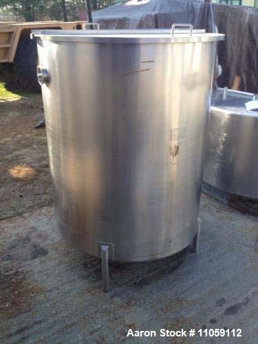 Used 450 Gallon Sanitary Stainless Steel Tank. 4' diameter x 4'10" T/T. Mfg. by Harry Holland and Son. Hinged lid, slope bottom with 3" side bottom outlet. Inside partition that is open on the bottom...