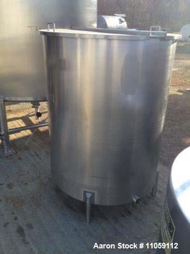 Used 450 Gallon Sanitary Stainless Steel Tank. 4' diameter x 4'10" T/T. Mfg. by Harry Holland and Son. Hinged lid, slope bottom with 3" side bottom outlet. Inside partition that is open on the bottom...