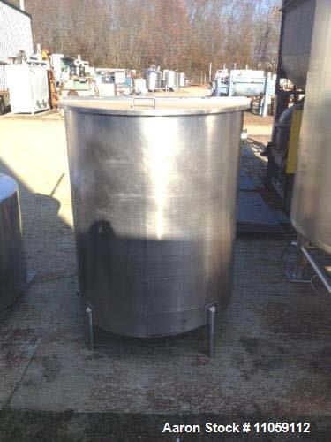 Used- 450 Gallon Sanitary Stainless Steel Tank. 4' diameter x 4'10" T/T. Mfg. by Harry Holland and Son. Hinged lid, slope bo...