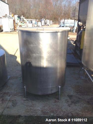 Used 450 Gallon Sanitary Stainless Steel Tank. 4' diameter x 4'10" T/T. Mfg. by Harry Holland and Son. Hinged lid, slope bottom with 3" side bottom outlet. Inside partition that is open on the bottom...