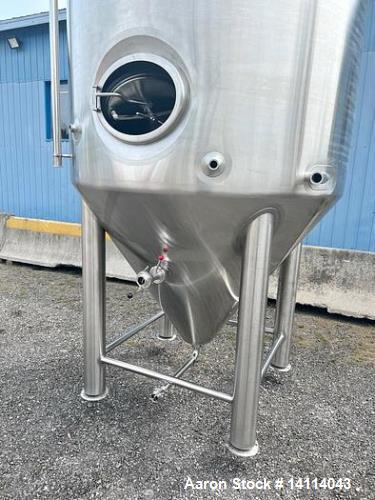 Unused- 2000 Gallon 304 Stainless Steel Jacketed Brewery Tank. Insulated. 51 BBL Brewery Tank. Jacketed for cooling, rated 36.25psi. Cone bottom discharge: 2" tri-clamp with pipe to side and butterfl...