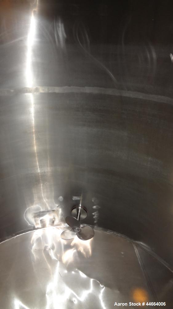 Used Charles S. Jacobwitz Tank, 1500 Gallons, 304 Stainless Steel, Vertical. Approximately 78"diameter x 70" straight side, open top with (1) cover, cone bottom. Side bottom entering agitator with (3...