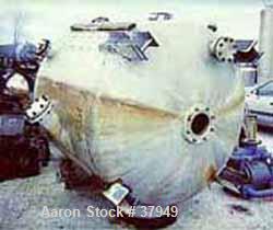 USED: McIver Smith 1000 gal vertical tank. Flat top, dished bottom. The tank includes the following nozzles: top (1) 10" flanged, (1) 6" flanged, (1) 8" flanged center for agitator, 16 x 30" charging...