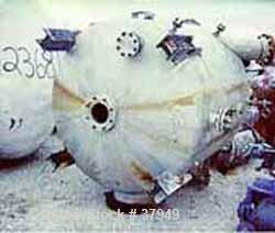 USED: McIver Smith 1000 gal vertical tank. Flat top, dished bottom. The tank includes the following nozzles: top (1) 10" flanged, (1) 6" flanged, (1) 8" flanged center for agitator, 16 x 30" charging...