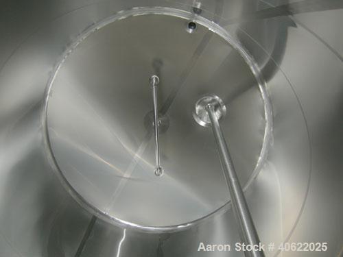 Used DCI tank, 4500 gallon, 304 stainless steel, jacketed. 89 1/4" diameter x 168" straight side. Dish top, sloped bottom. 22" bottom sidewall dimple jacket rated 150 psi @ 100 degrees F. Top opening...